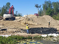 Installing void-filled Riprap at Eaton Brook Bridge